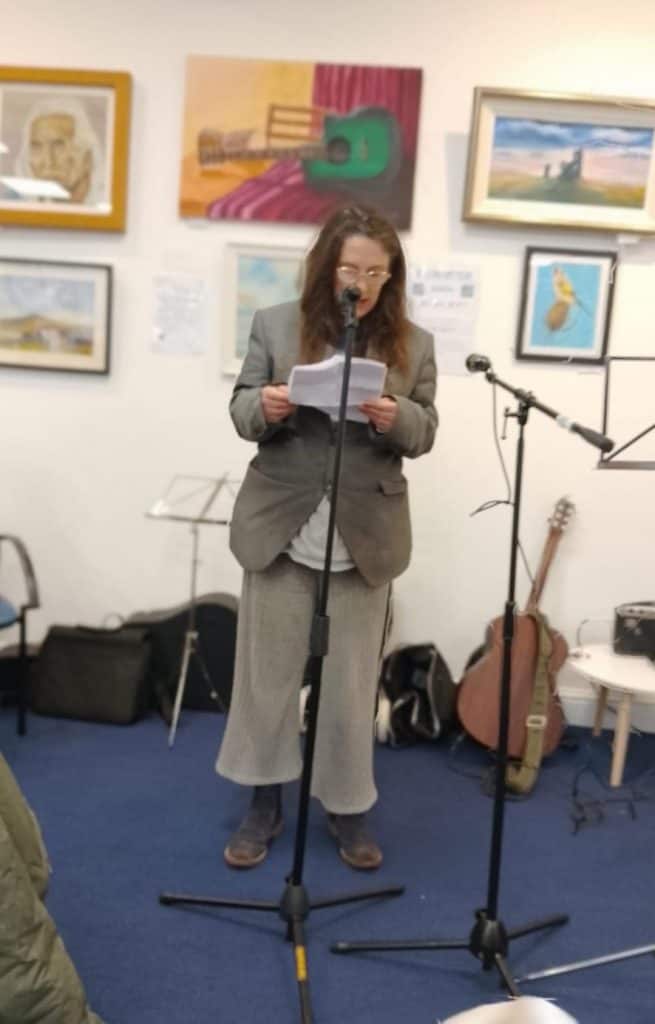 Mel reading at World Poetry Day, 2025